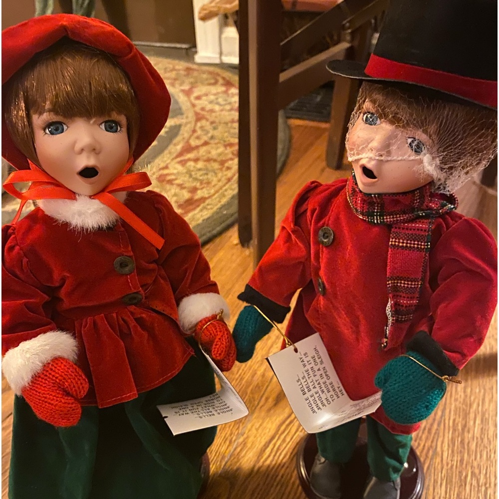 Brand new! Heritage Signature Porcelain Christmas Carolers. Boy & girl dolls.